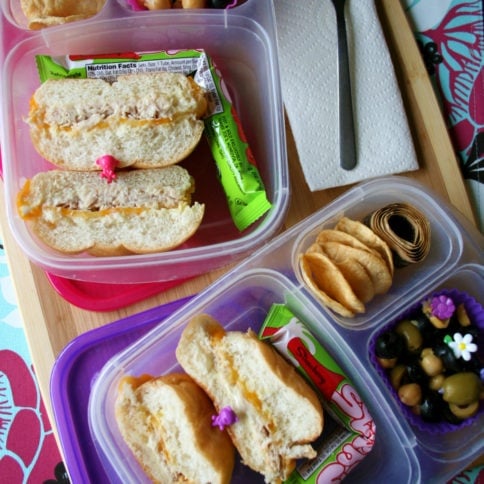 Bean and olive salad packed in a lunchbox with sandwich