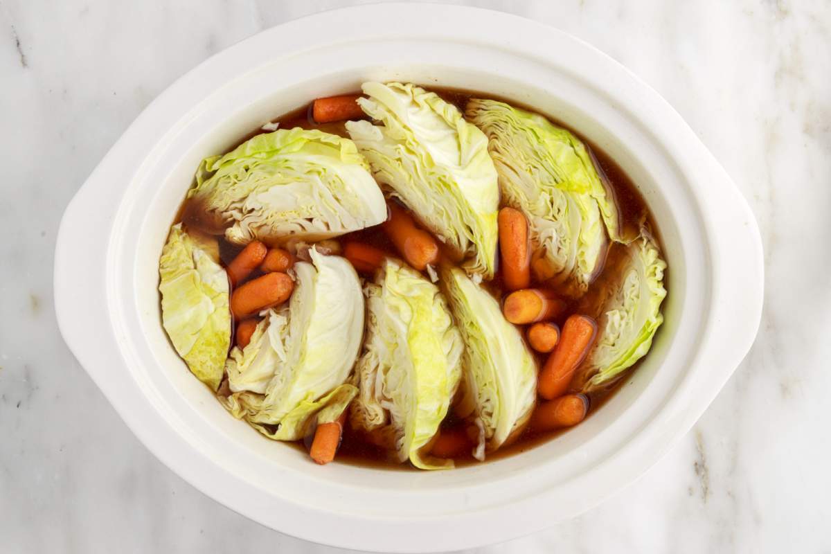 cabbage wedges added to slow cooker