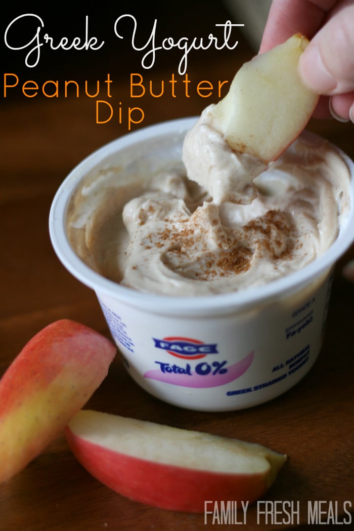 Dipping an apple slice in yogurt dip