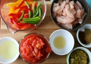 Baked Fajitas Ingredients - Chicken, bell peppers, tomatoes, seasonings, oil, green chilis
