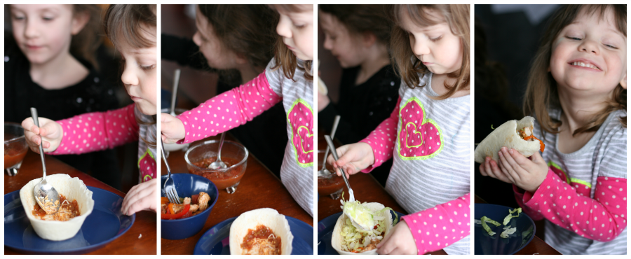 showing 2 children assembling taco boats with baked fajitas