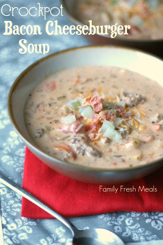 Crockpot Bacon Cheeseburger Soup served in a bowl, topped with chopped pickles