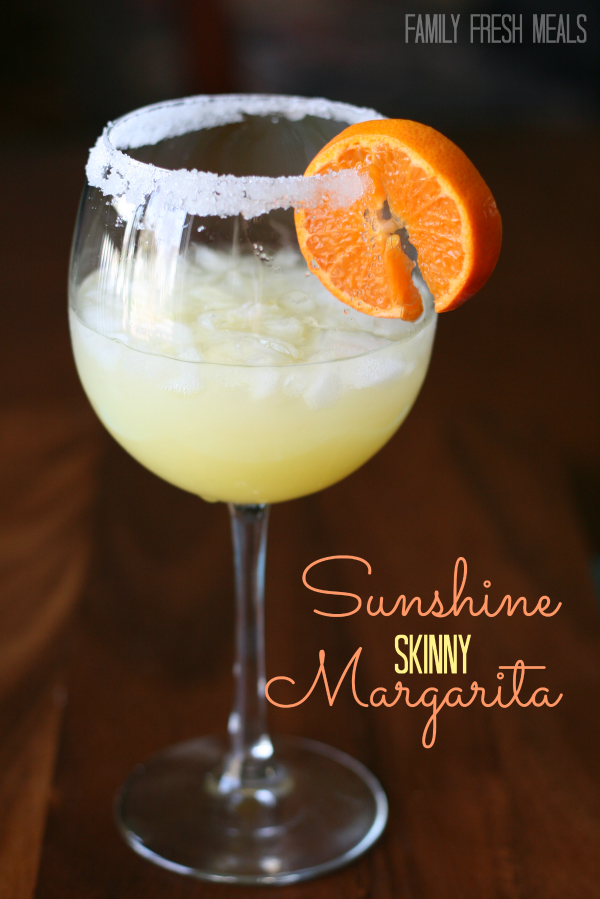 Sunshine Skinny Margarita served in a cocktail glass with a slice of orange