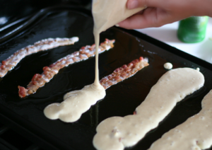 pour pancake batter over bacon 