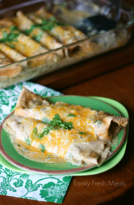 Avocado Chicken Enchiladas cooked and served on a green plate