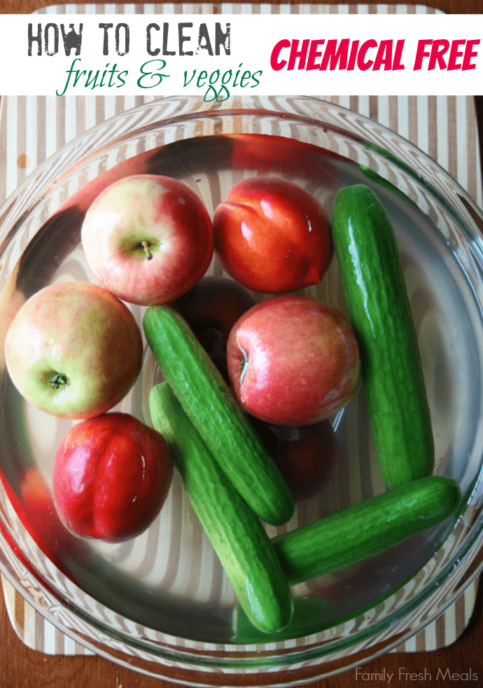 fruit and vegetables in a large bowl with water