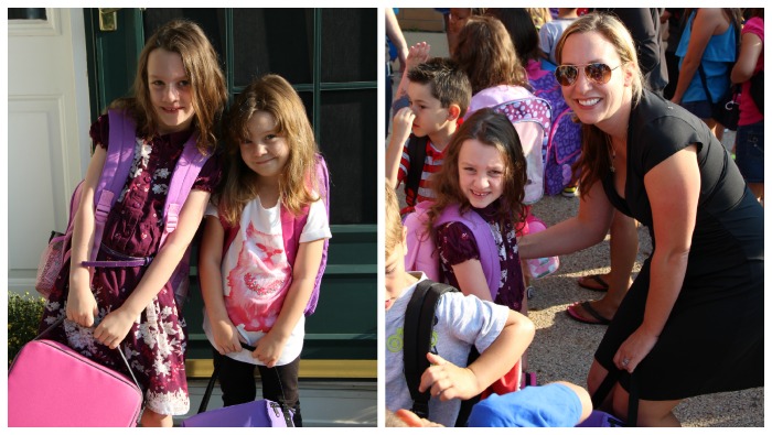 children with backpacks on and holding lunchbox bags