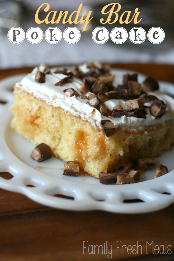 Piece of Candy Bar Poke Cake on a white plate