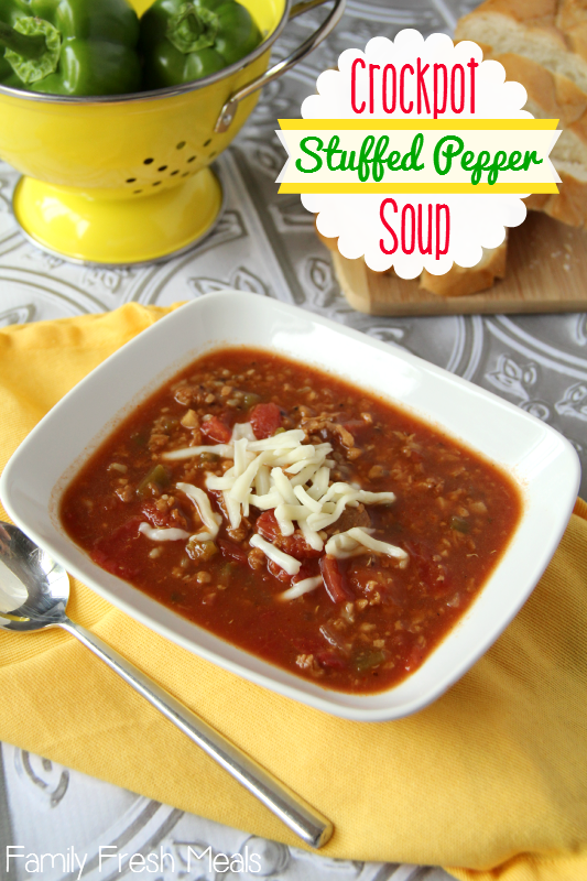 Crockpot Stuffed Pepper Soup served in a white bowl, topped with shredded cheese