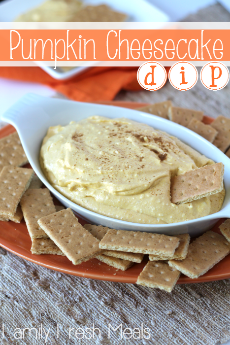 Pumpkin Cheesecake Dip served in a white dish with graham crackers