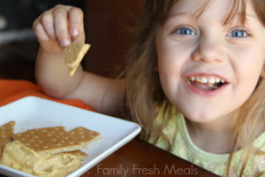 Child eating Pumpkin Cheesecake Dip