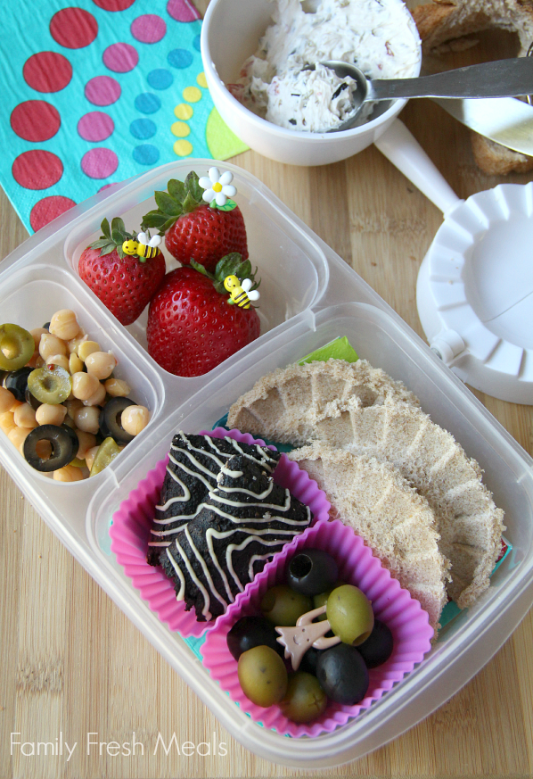 Sandwich pockets packed with a side of Black and Green Chickpea Salad, strawberries, granola bar, and some extra Lindsay Olives.  