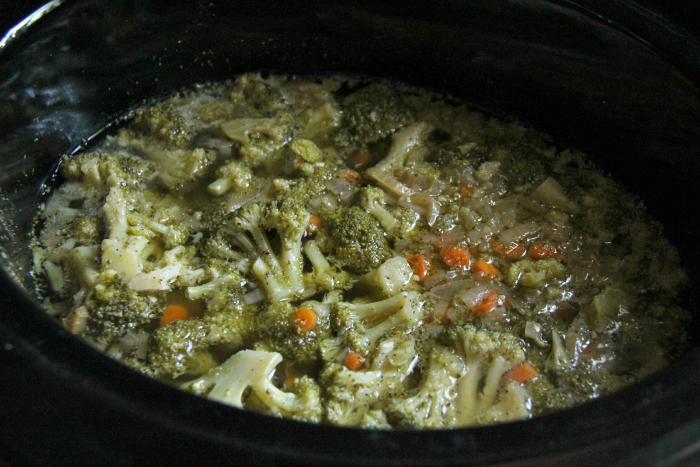 veggies, seasoning and broth in crockpot