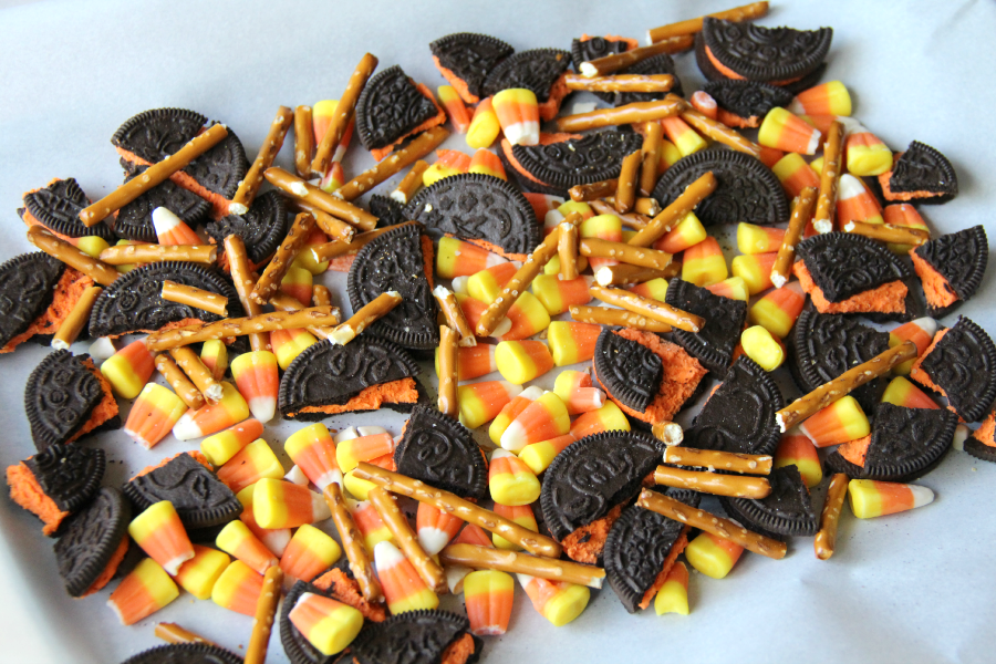 Broken cookies, pretzels and about 1 cup of the candy corn on a prepared cookie sheet