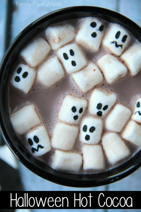 hot cocoa with marshmallows that have ghost faces on them