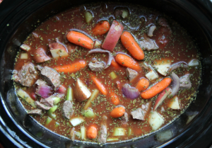 vegetables, broth, beef, tomato paste and seasonings in a crockpot