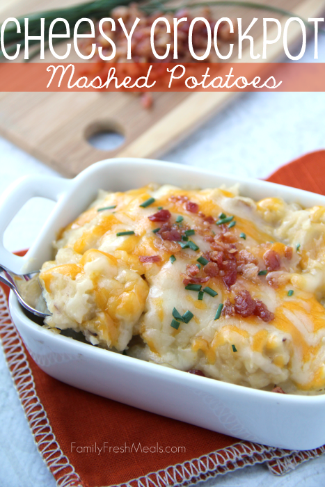 Mashed potatoes topped with cheese and bacon, served in a white bowl