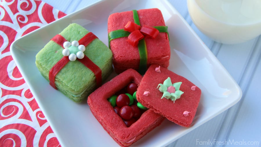 Green and red cookies on a white plate