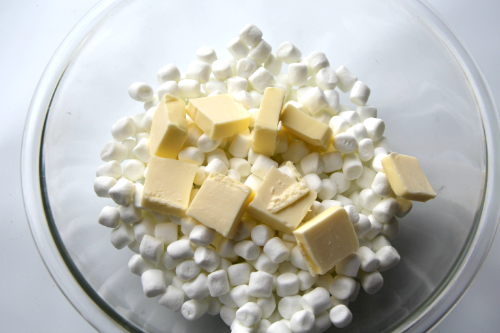 marshmallows and tabs of butter in in a mixing bowl