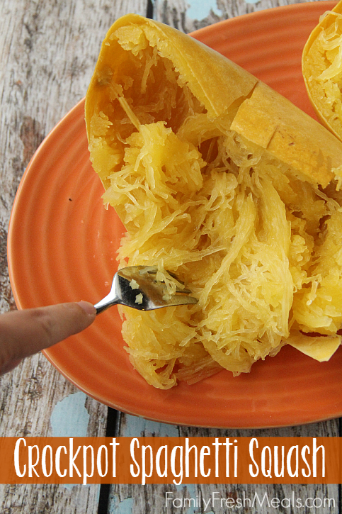 Spaghetti Squash cut open and fork pulling out pieces