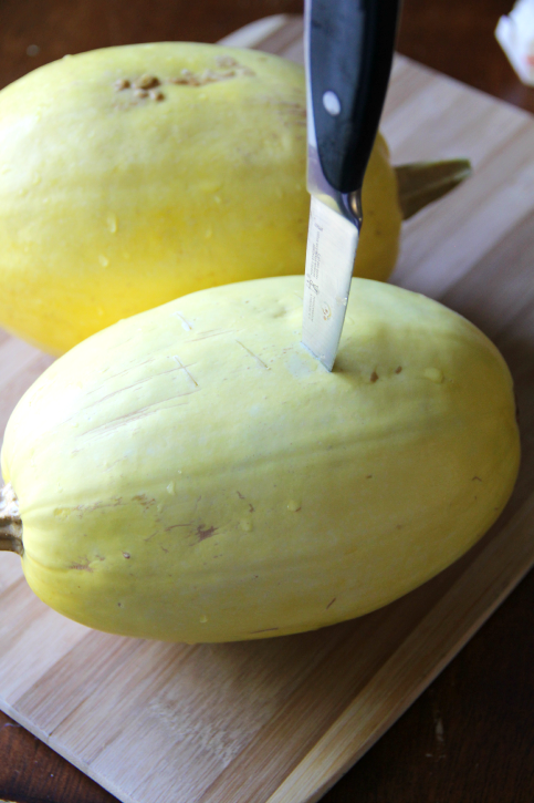 knife poking into a Spaghetti Squash