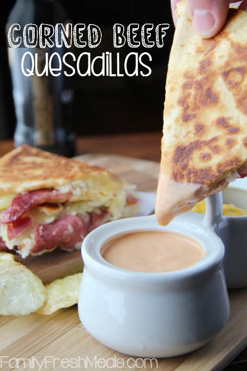 Corned Beef and Cabbage Quesadillas - Dipping into a sauce