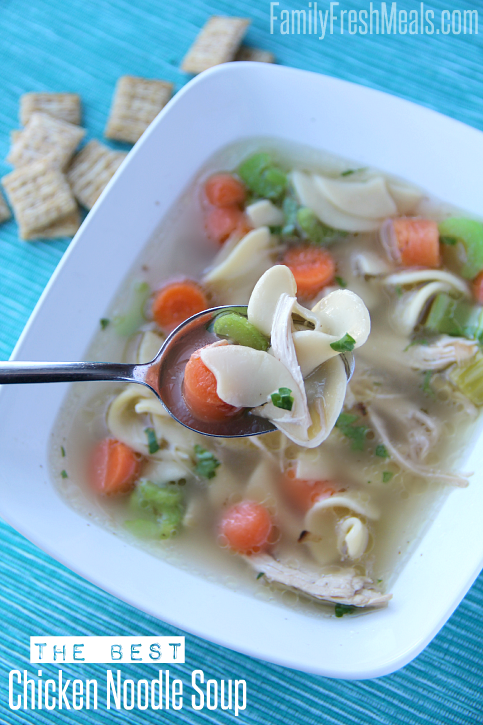 Bowl of Chicken Noodle Soup with a side of small crackers