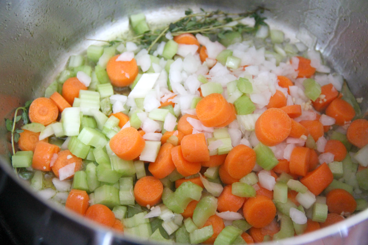 chopped vegetables in a soup pot