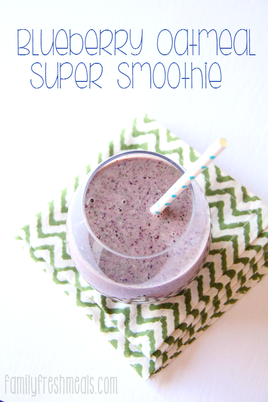 Blueberry Oatmeal Super Smoothie in a glass cup with a straw