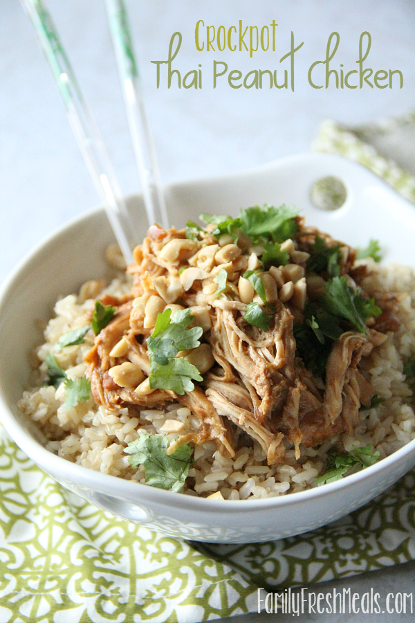 Thai Peanut Chicken served over rice in a white bowl with chop sticks