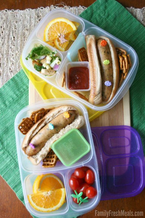 Top down image of 2 lunch boxes with Hot dogs packed for lunch 