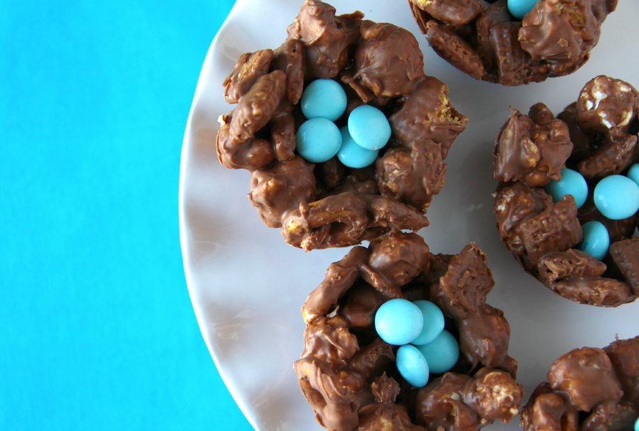 No Bake Easter Nest Treats with blue chocolates on a white platter
