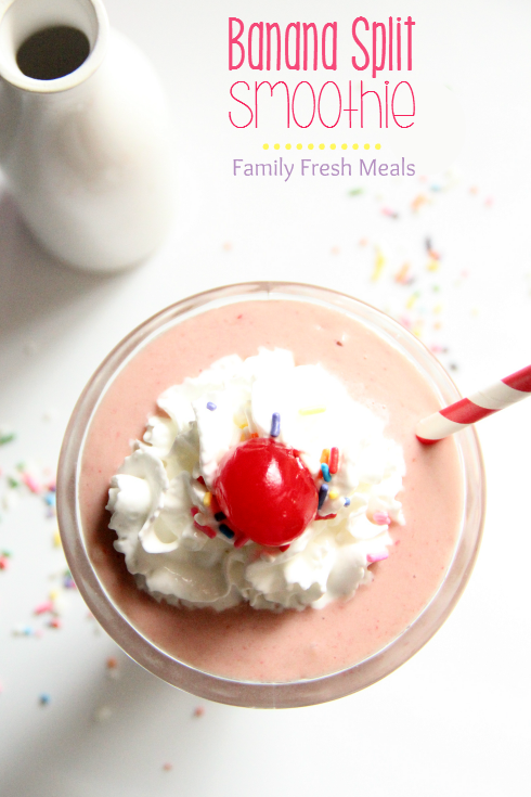 Banana Split Smoothie topped with whipped cream and a cherry