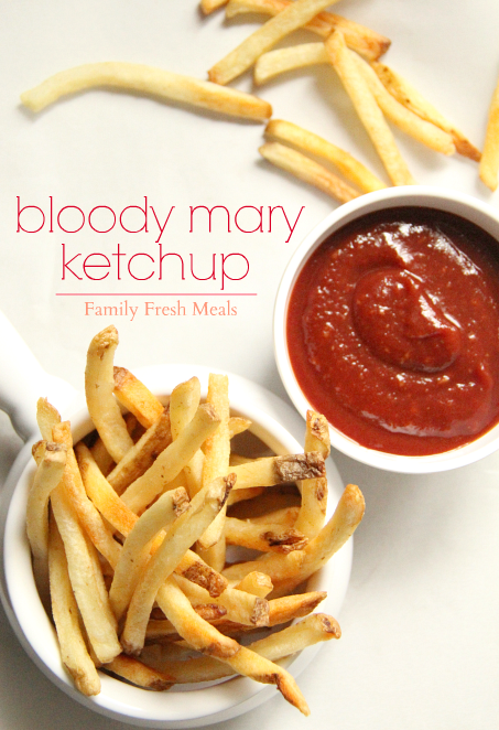 ketchup in a small bowl with with a medium bowl of fries