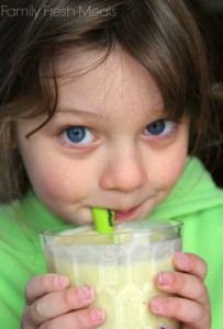Child drinking the Tropical Avocado Smoothie