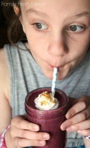 Child drinking Blueberry Pie Smoothie