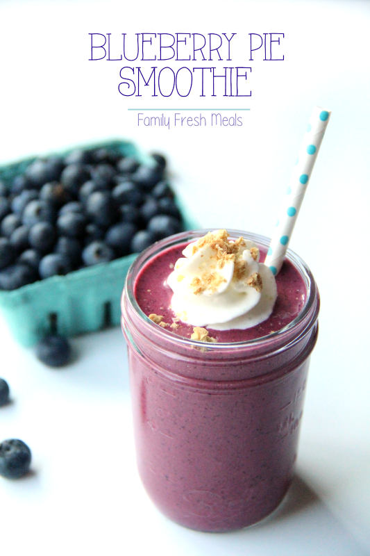Blueberry Pie Smoothie in a glass cup with a straw
