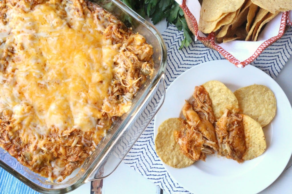 Cheesy Chicken Enchilada Dip - Dip and chips served on a plate 