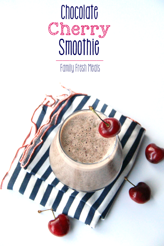 Chocolate Cherry Smoothie in a glass, surrounded by fresh cherries