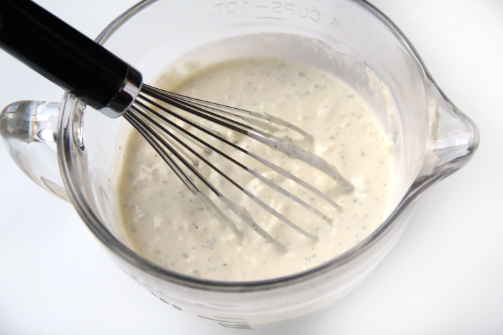 whisking ranch sauce