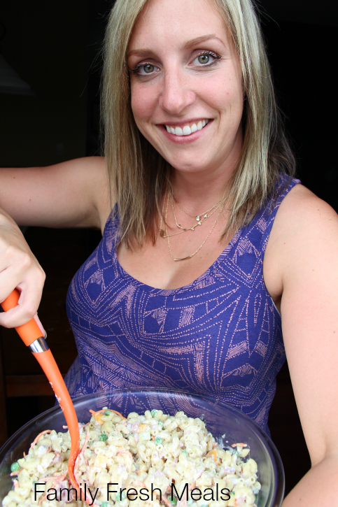 Woman holding a large bowl of Creamy Ranch Pasta Salad
