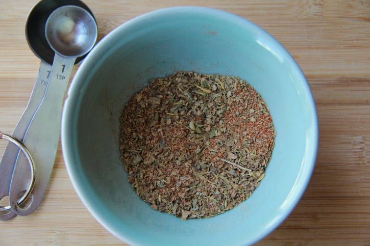 Dry seasoning in small blue bowl 