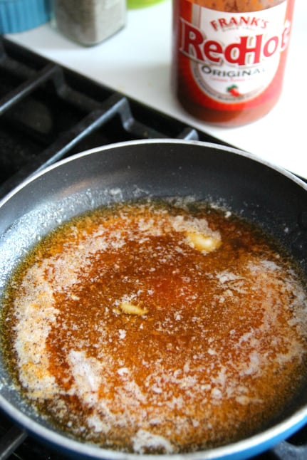 hot sauce and butter in a frying pan