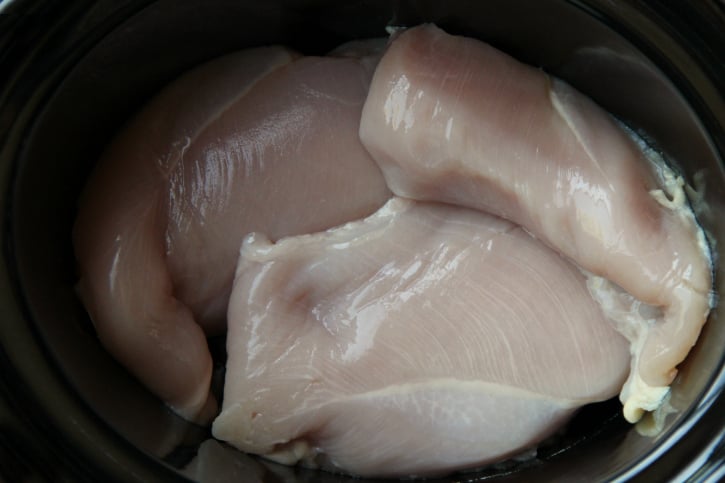 raw chicken inside crockpot