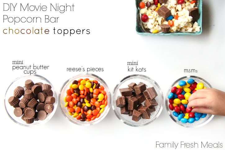 bowl of popcorn with 4 bowls of chocolate candies