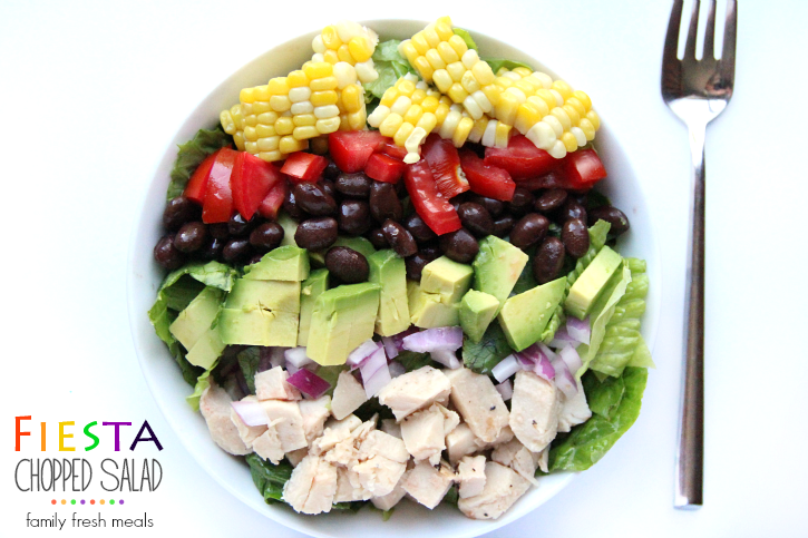 Fiesta Chopped Salad in a white bowl with a fork next to the bowl