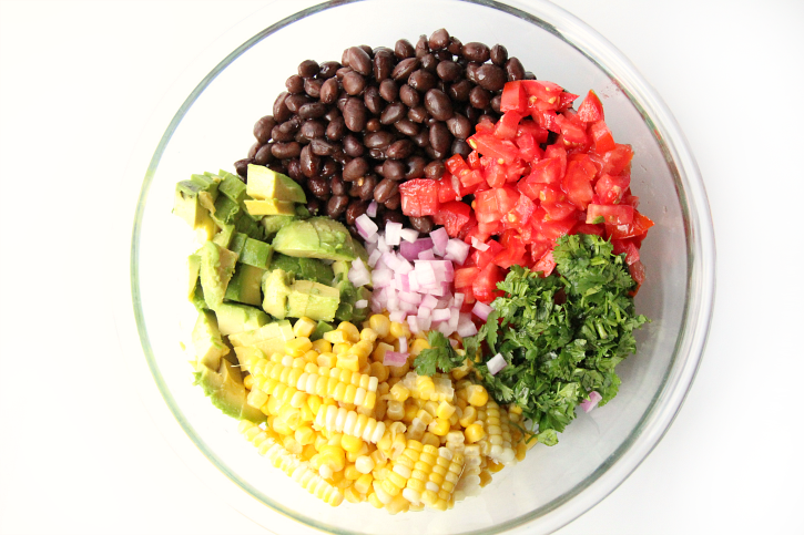 Ingredients for Cowboy Caviar Recipe in a glass bowl