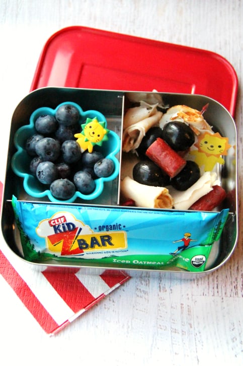 Turkey, sausage and olive kabobs, blue berries and a granola bar - packed in a lunchbox