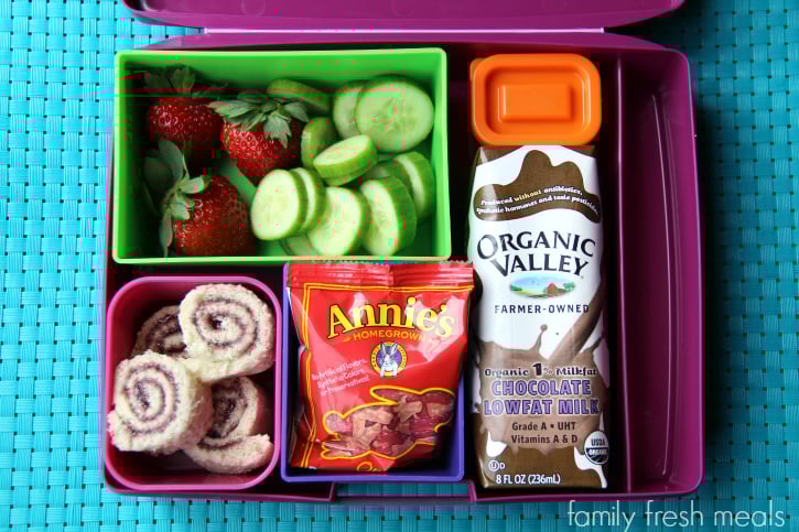 jelly sushi, strawberries, cucumbers, a container of dip, Annie’s Homegrown Fruit Snacks and an Organic Valley Milk.  Packed in a Lunchbox