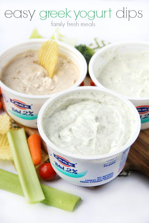 the containers of greek yogurt dip with veggies and chips